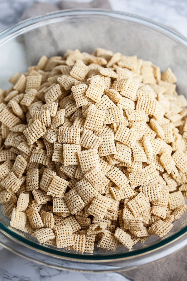 Rice Chex in large glass mixing bowl.