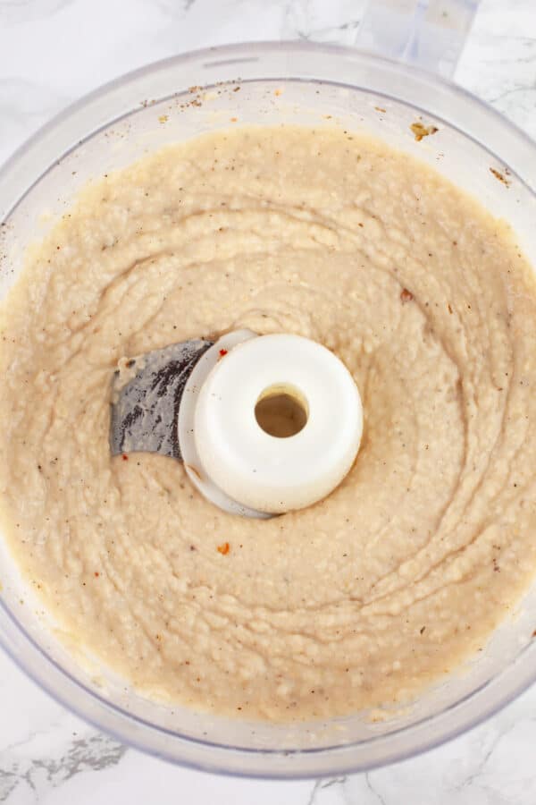 Pureed white bean dip in food processor.